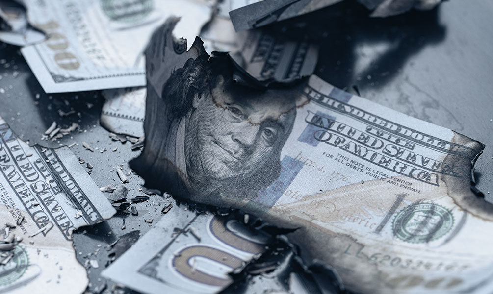 burned 100 dollar bills